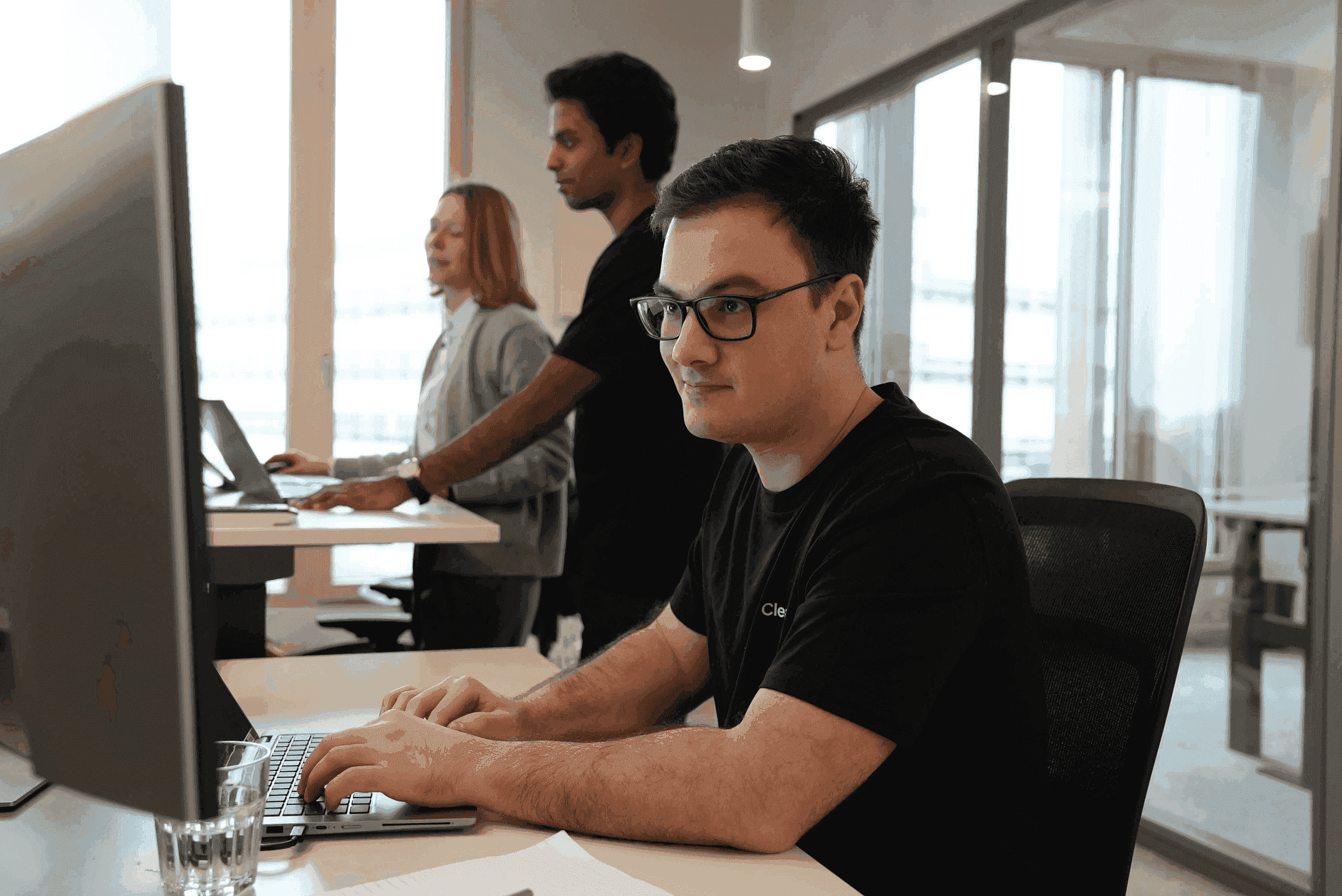 A ClearOps colleague working on a laptop